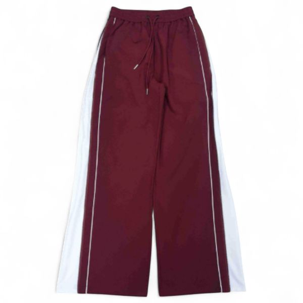 Maroon track pants with white stripes on a white background