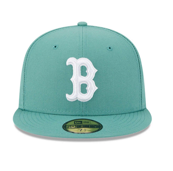 Teal baseball cap with a white logo on a white background