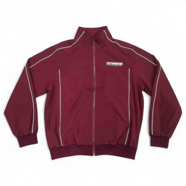 Maroon jacket with white piping on a white background