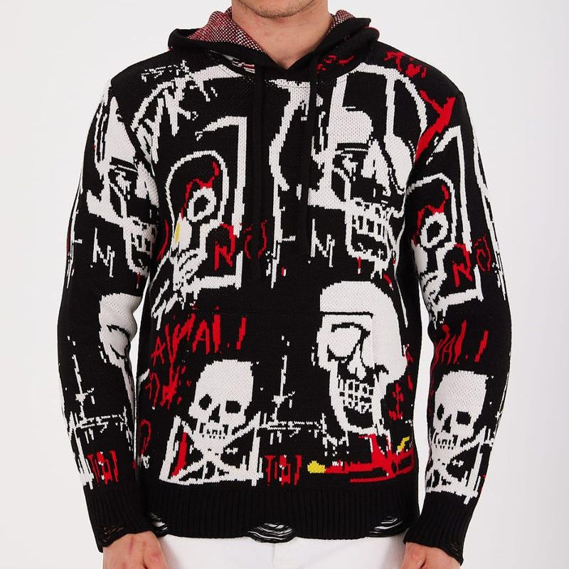 Person wearing a black hoodie with graphic designs on a white background